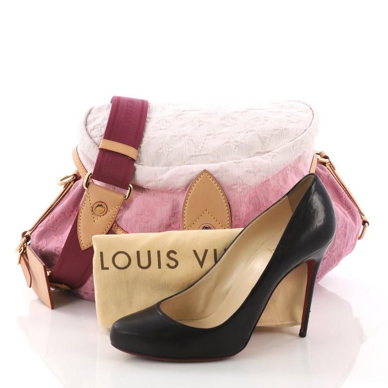 This Louis Vuitton Sunshine Handbag Denim, crafted from pink denim, features adjustable flat nylon strap, cowhide leather trims, and gold-tone hardware. Its large raised flap top with buckle closure opens to a pink microfiber interior with slip