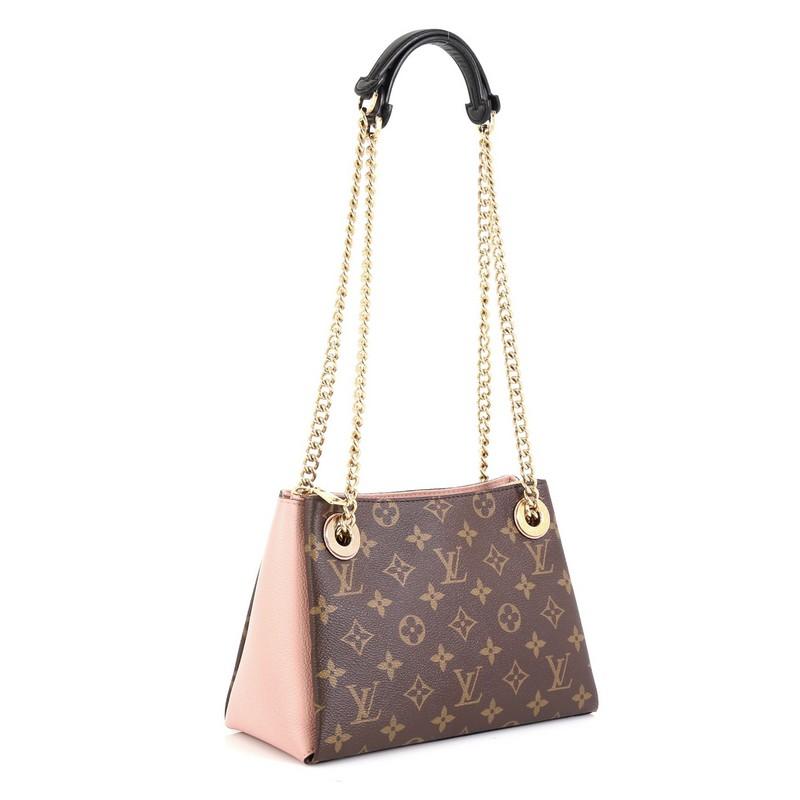 This Louis Vuitton Surene Handbag Monogram Canvas with Leather BB, crafted from brown monogram coated canvas with pink leather, features dual chain link straps with leather pads and gold-tone hardware, It opens to a pink microfiber interior with two