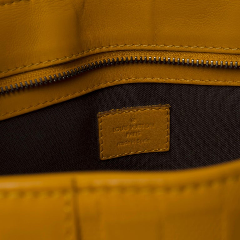 Women's or Men's Louis Vuitton Tadao Shoulder bag in Yellow empreinte leather, black silver metal For Sale