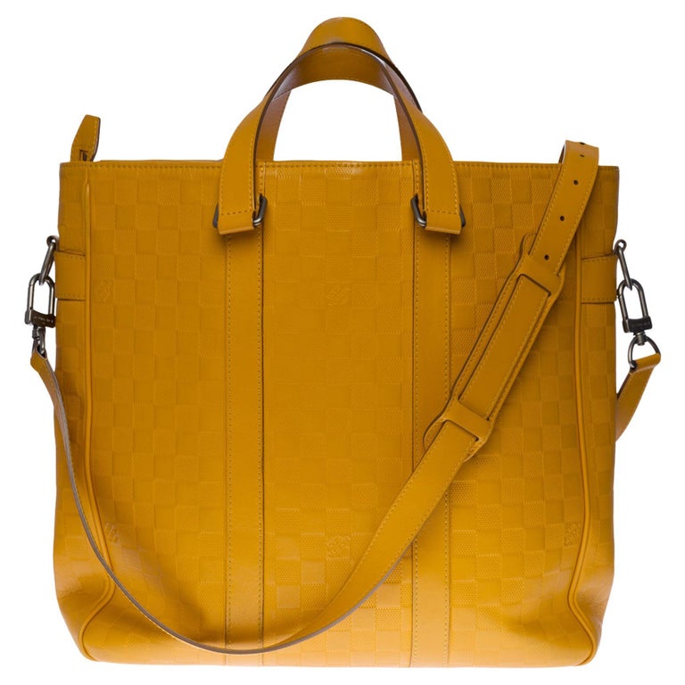 Louis Vuitton Tadao Shoulder bag in Yellow empreinte leather, black silver metal For Sale