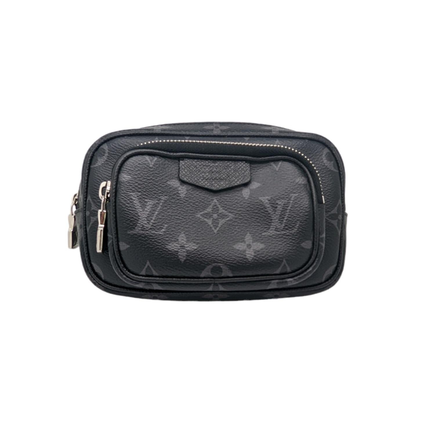 This stylish shoulder bag is crafted of cross-grain taiga leather, with classic Louis Vuitton monogram Eclipse coated canvas. The bag features a front zipper pocket and an adjustable coated canvas shoulder strap with polished silver hardware. The