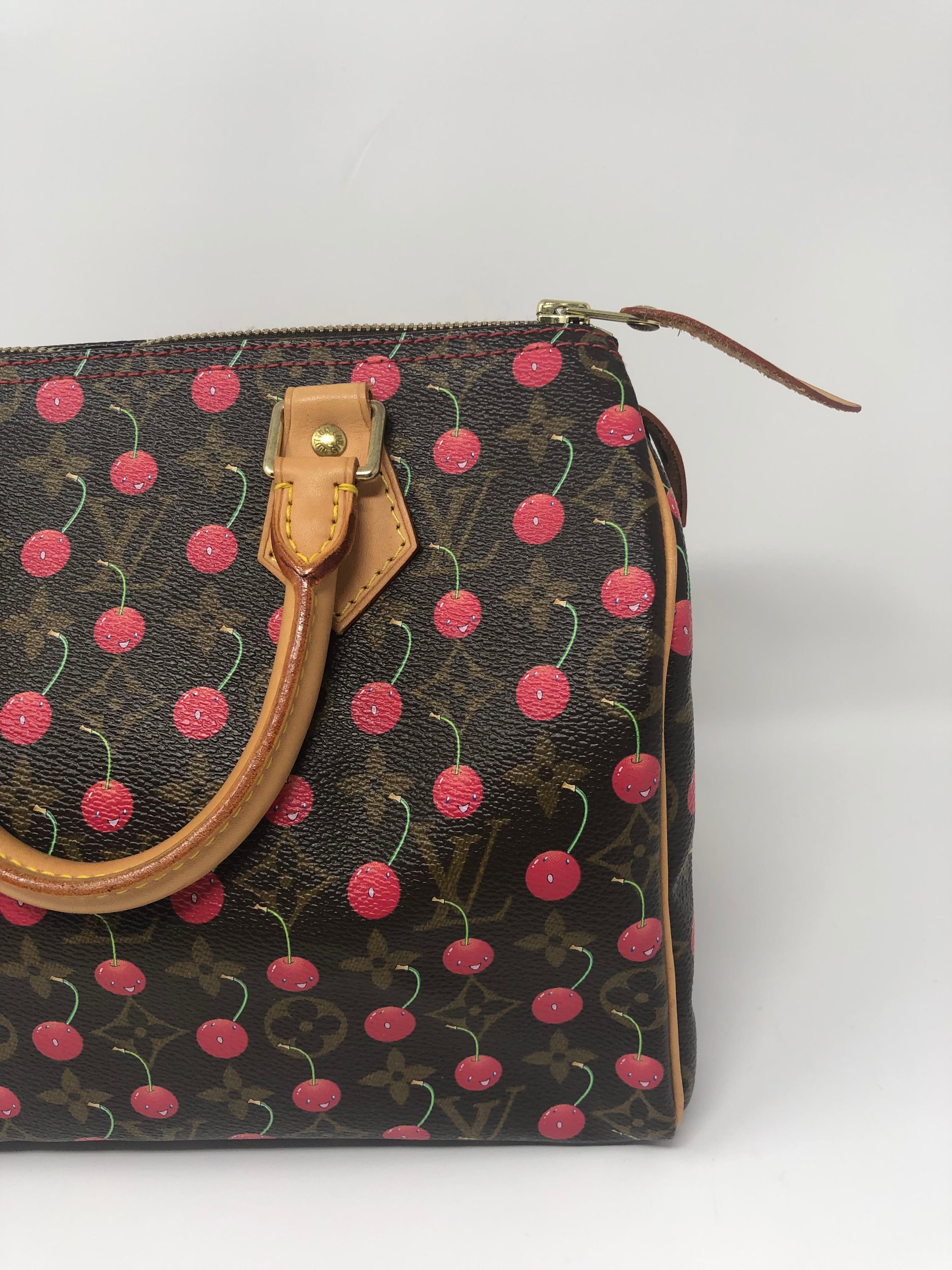 Louis Vuitton x Murakami Monogram Cherry Speedy 25. Limited edition special collaboration with famous Japanese artist Takashi Murakami. Rare and iconic. The cherries stand out in this collector's piece. Bag is in excellent condition. Includes lock