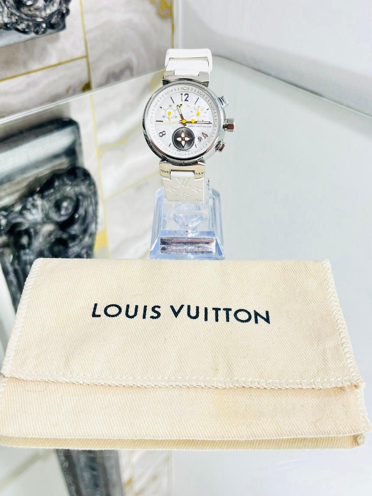 Louis Vuitton Tambour Chronograph Watch

Mother of pearl watch face set with in a stainless steel case.

Date display, chronograph dials,  LV motif dial. Outer Case is

engraved on the outer with 'Louis Vuitton'. Quartz movement.

'LV' logo and