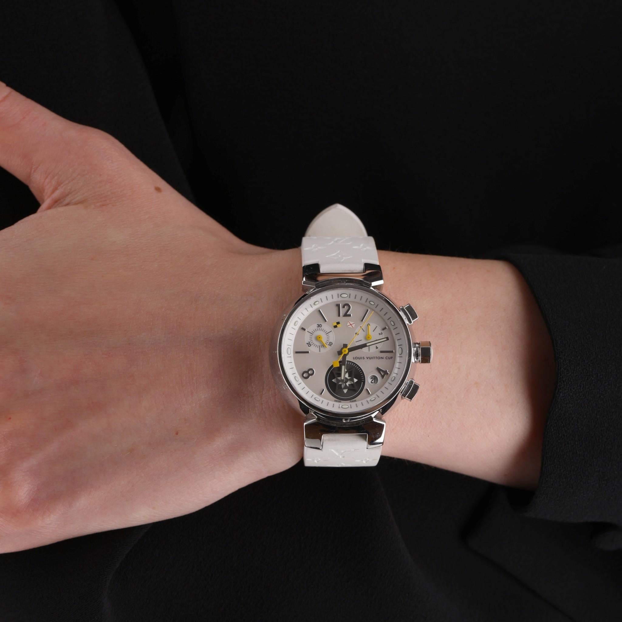Louis Vuitton Tambour Lovely Cup Chronograph Watch

Mother of pearl watch face set in a stainless steel case.

Date display, chronograph dials,  LV motif dial.

Outer case is engraved on the outer with 'Louis Vuitton'. Quartz movement.

'LV' logo