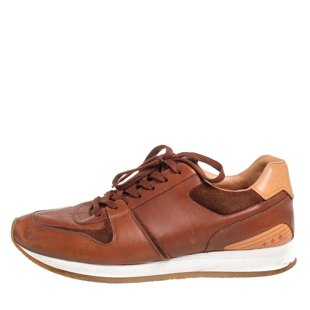 Stylish and super comfortable, these low-top sneakers by Louis Vuitton will make a great addition to your shoe collection. They have been designed using tan leather and styled with round toes and lace-ups on the vamps. Leather insoles and rubber