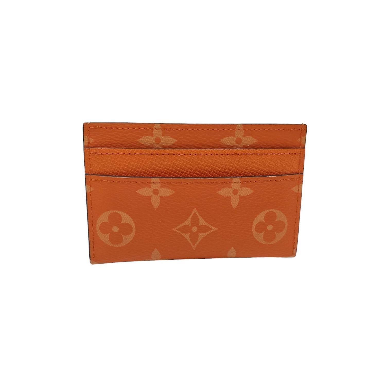 Indulge in luxury with the Louis Vuitton Monogram Porte Cartes Card Holder. Made in France and crafted with the iconic Monogram Reverse coated canvas in Tangerine, this card holder exudes sophistication. Featuring 5 card slots, it also has a leather