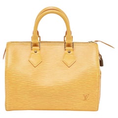 Louis Vuitton sac Speedy 25 en cuir épi jaune gaufré