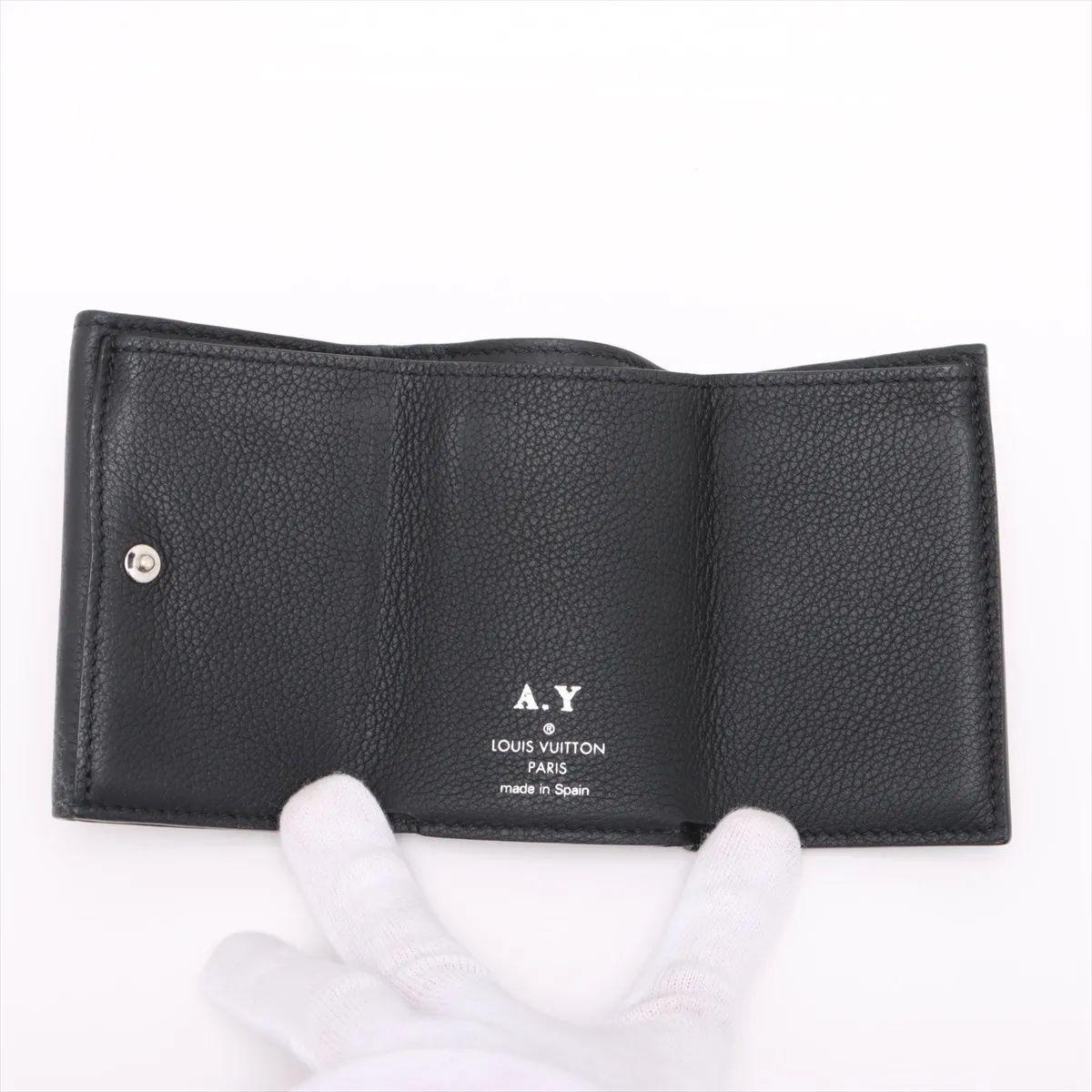 Women's Louis Vuitton Taurillon Lockmini Wallet Noir For Sale