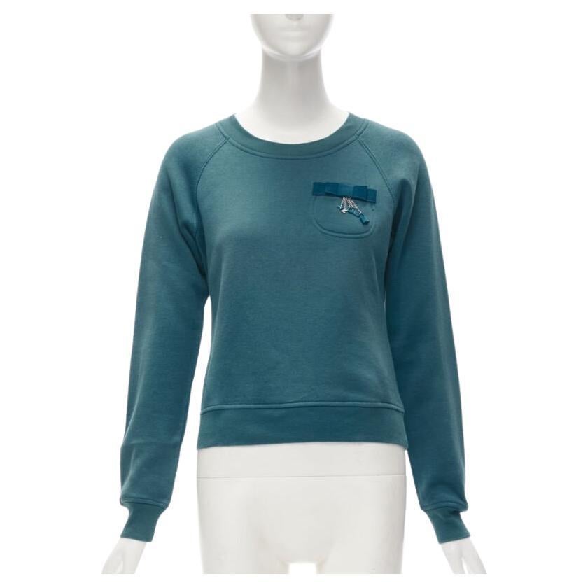 LOUIS VUITTON teal blue bow lock charm patch pocket cotton fleece sweater S For Sale