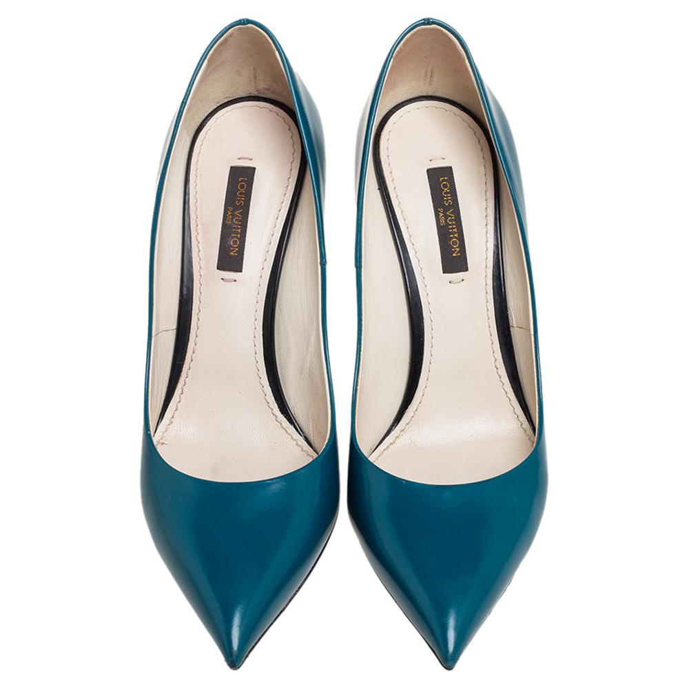 These Louis Vuitton pointed-toe pumps offer a timeless appeal. Perfect for work or casual events, they feature a teal blue leather exterior, a straight stiletto heel, and a chic gold-tone trim at the back with the brand name on it.

Includes:
