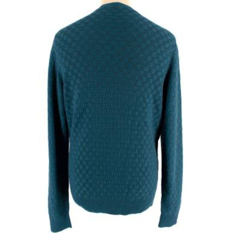 Louis Vuitton Teal Damier Crew Neck Knit Jumper

- Monotone teal checked knit jumper 
- Round neckline with ribbed trims 
- Black leather logo patch on the bottom left corner
- Medium weight knitted from Louis Vuitton's exclusive RWS-certified Pont