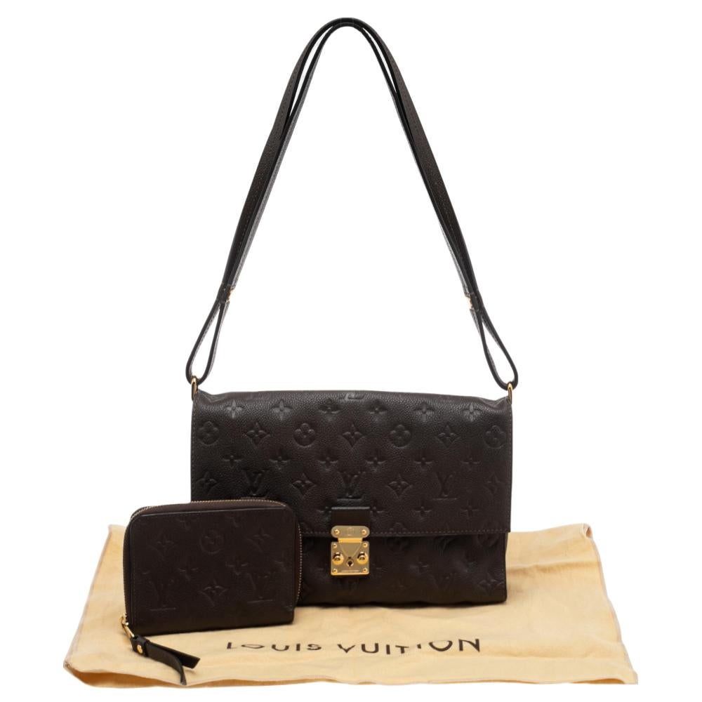 Louis Vuitton's handbags remain globally popular owing to their high style and functionality. Stylish and durable, this Fascinante bag exudes a modern touch. It has been made using Terre Monogram Empreinte leather on the exterior with a distinct