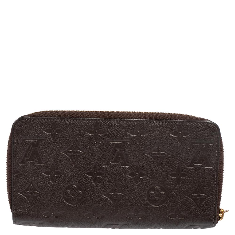 The fine artistry and the sleek structure of the bag exhibit Louis Vuitton's years of impeccable craftsmanship. Made from Terre Monogram Empreinte leather, this long wallet is secured with a zipper closure.

Includes: Original Dustbag