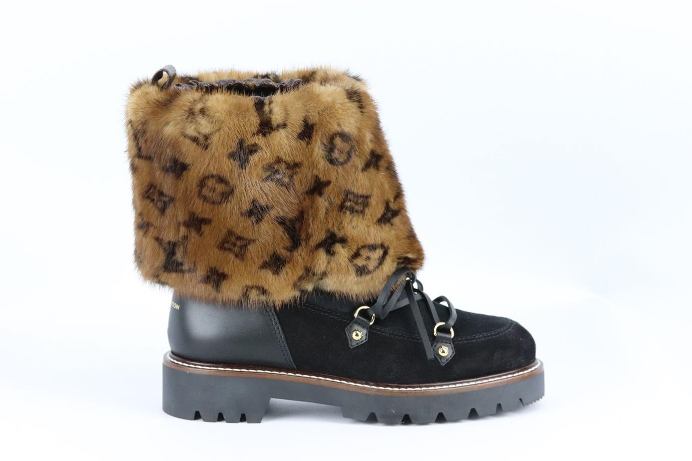 Louis Vuitton Territory mongrammed mink fur and suede ankle boots. Black and brown. Pull on. Does not come with box or dustbag. Size: EU 38 (UK 5, US 8). Outersole: 10.3 in. Shaft: 7.4 in. Heel: 1.4 in. New without box
