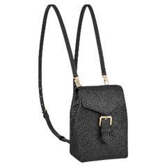 Sac à dos Louis Vuitton Tiny en cuir noir avec monogramme Empreinte