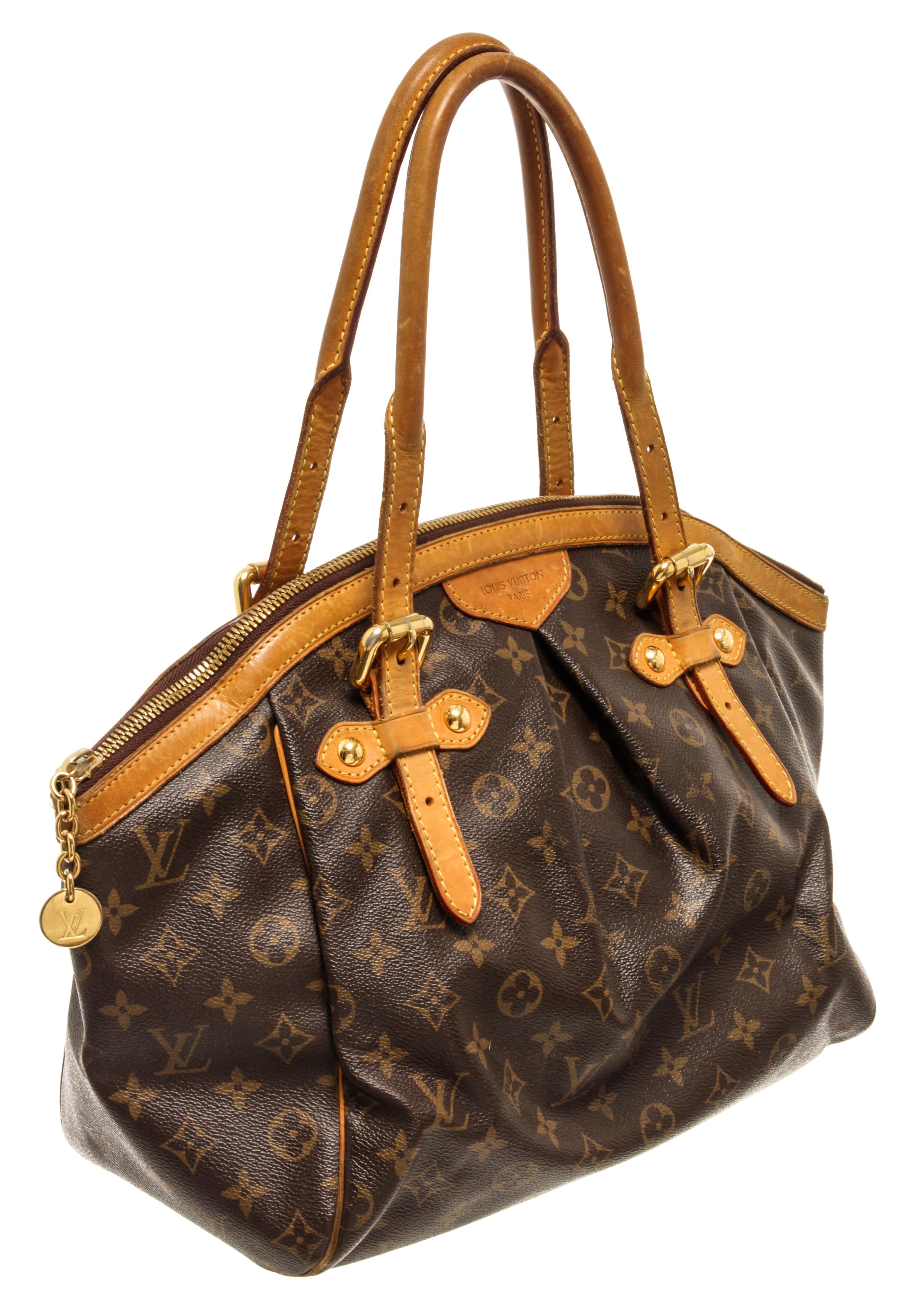 Louis Vuitton Brown Monogram Canvas Tivoli GM Satchel Bag with gold tone hardware, dual adjustable shoulder straps, leather trim embellishment, canvas lining & three interior pockets, zip closure at top, protective feet at base

72990MSC