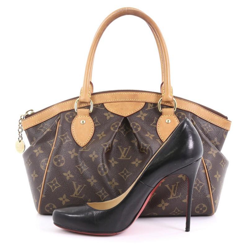 This Louis Vuitton Tivoli Handbag Monogram Canvas PM, crafted from brown monogram coated canvas, features dual rolled handles, subtle pleats in the middle, and gold-tone hardware. Its top zip closure opens to a brown fabric interior with slip