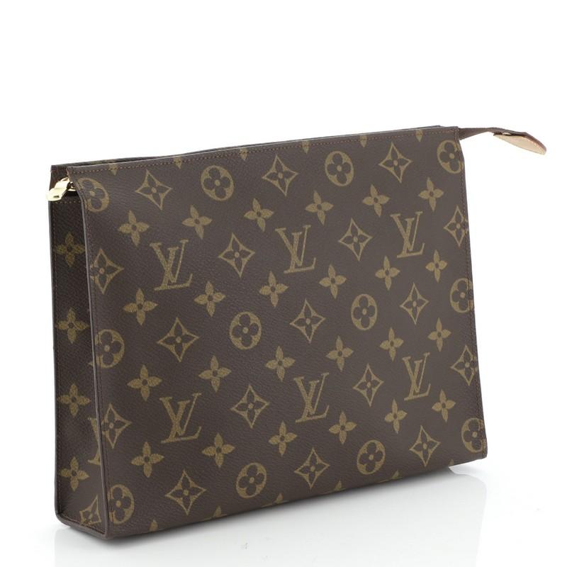 This Louis Vuitton Toiletry Pouch Monogram Canvas 26, crafted in brown monogram coated canvas, features gold-tone hardware. Its zip closure opens to a brown leather interior. Authenticity code reads: AN0971.

Estimated Retail Price: $445
Condition: