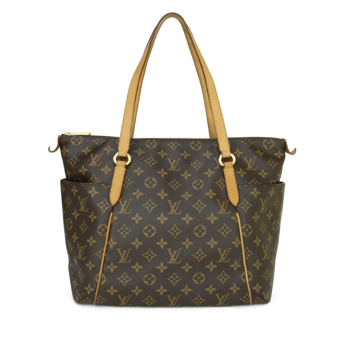 Louis Vuitton Totally MM Bag in Monogram 2011.

This bag is in good condition. 

- Exterior Condition: Good condition. Light rubbing to four base corners. General marking, darkening and leather wear around the vachetta cowhide trim.

- Handles: Good