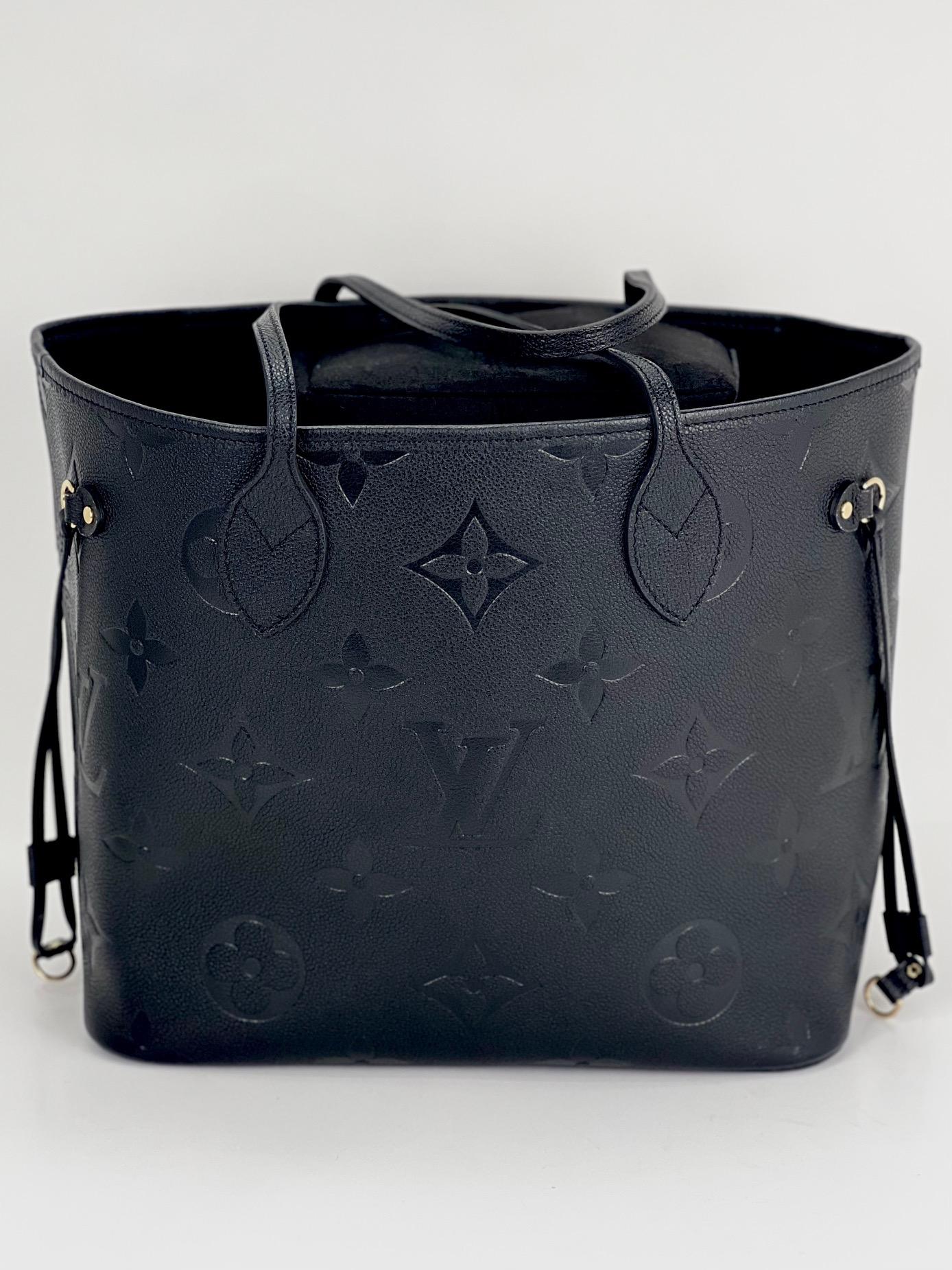 Louis Vuitton Neverfull MM Black Empreinte Leather 
W/added Insert to help keep Shape and Organize
Pre-Owned 100% Authentic
RATING: A+...excellent, near mint, only slight
signs of wear
MATERIAL: empreinte leather 
HANDLE:  double leather 
PIPING &