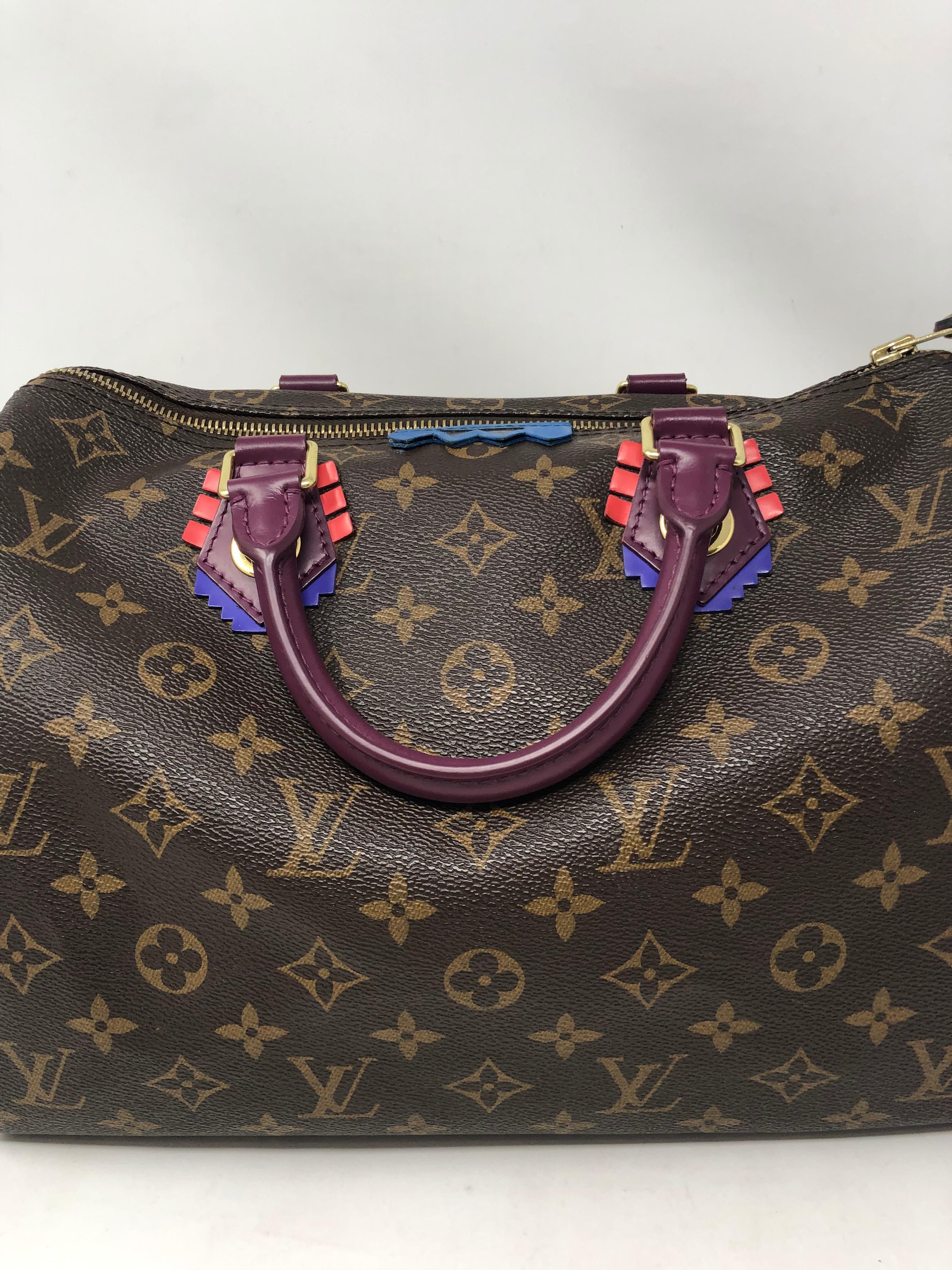 Louis Vuitton Totem Speedy 30. Rare and limited. Purple leather handles with tribal style embellished details. Collector's piece. Guaranteed authentic. 