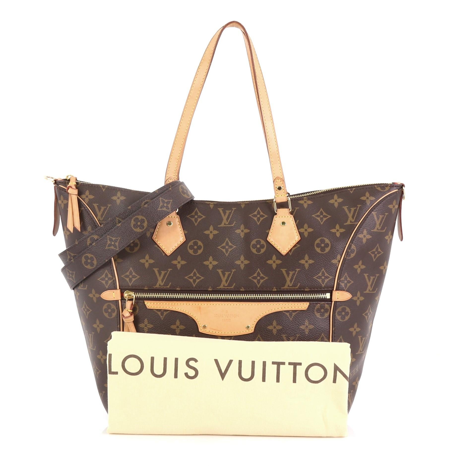 This Louis Vuitton Tournelle Tote Monogram Canvas MM, crafted in brown monogram coated canvas, features dual flat leather handles, vachetta leather trim, exterior zip pocket, and gold-tone hardware. Its zip closure opens to a red fabric interior