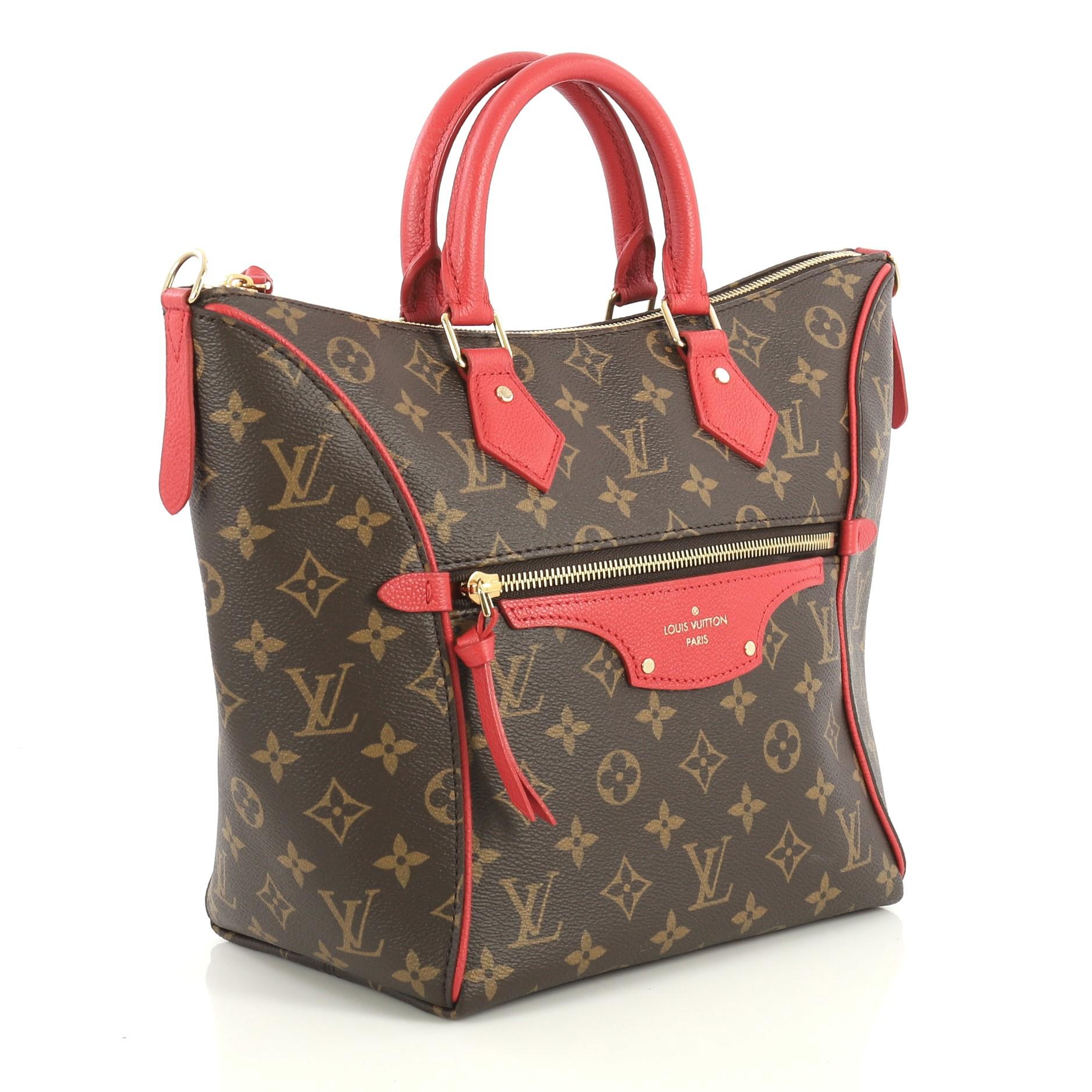 This Louis Vuitton Tournelle Tote Monogram Canvas PM, crafted in brown monogram coated canvas, features dual rolled leather handles, leather trim, exterior zip pocket, and gold-tone hardware. Its zip closure opens to a red fabric interior with slip