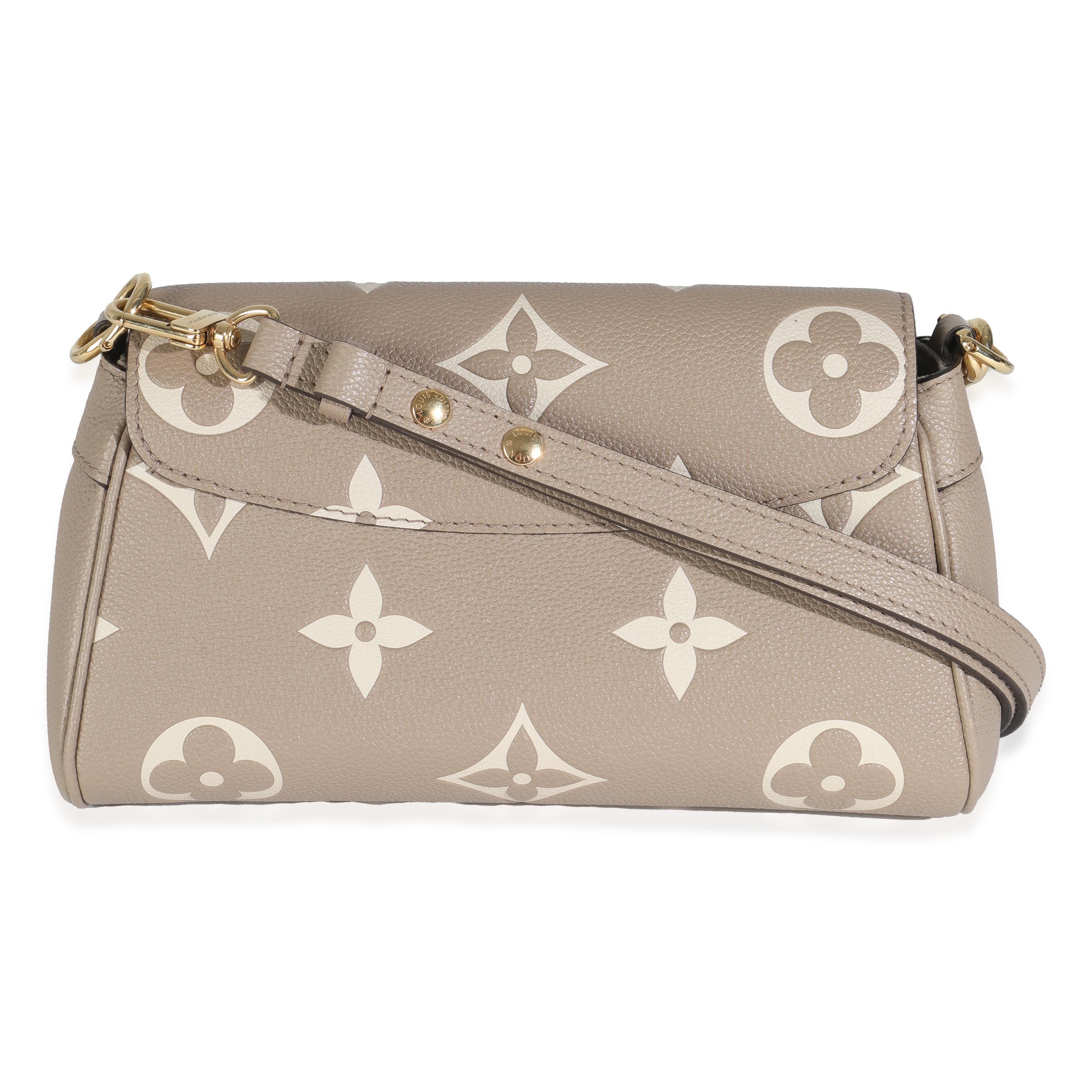 Listing Title: Louis Vuitton Tourterelle Creme Empreinte Monogram Giant Favorite
SKU: 144921
MSRP: 3150.00 USD
Condition: Pre-owned 
Handbag Condition: Excellent
Condition Comments: Item is in excellent condition and displays light signs of wear.  