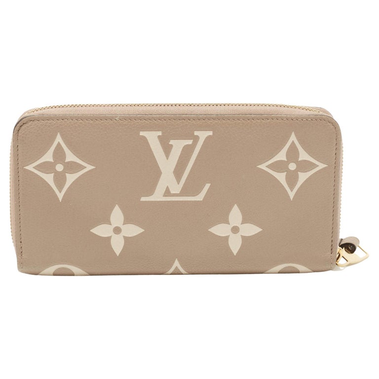 Louis Vuitton Tourterelle/Creme Monogram Empreinte Leather Zippy Wallet For  Sale at 1stDibs