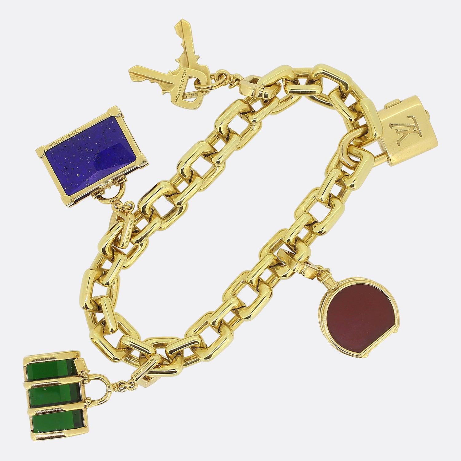 Here we have an outstanding charm bracelet from the world renowned luxury designer, Louis Vuitton. This playful piece offers a travel theme which is showcased via the use of charms including a variety of different luggage including a bisten