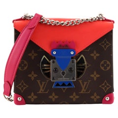 Masque tribal Louis Vuitton Pochette en toile Monogram PM