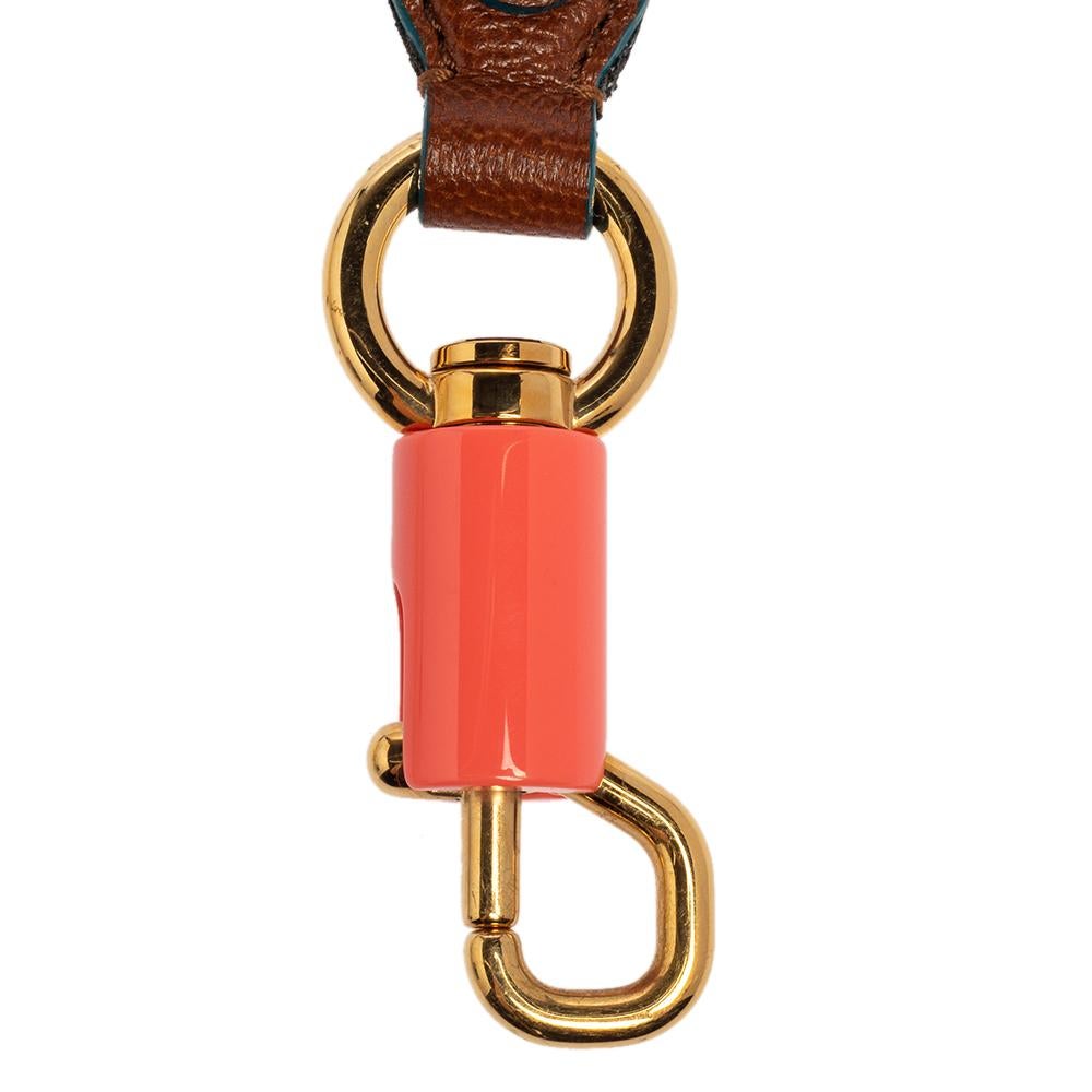 Luxury accessories are always a prize to own as they are designed to last and also to make you look fashionable. This Louis Vuitton key holder is no different. Crafted from multicolored nylon, we can't help but admire its fine finish and simple