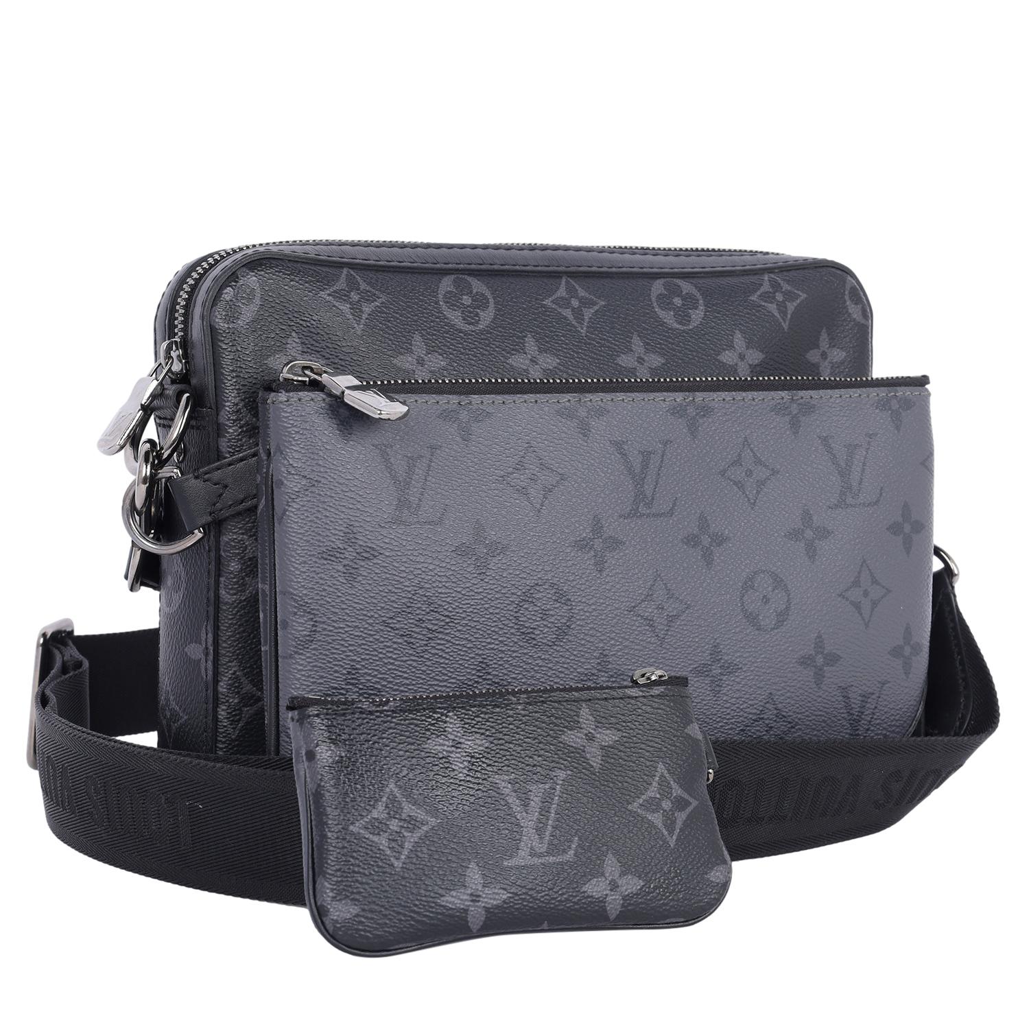 Authentic, pre owned Louis Vuitton Trio Messenger Eclipse crossbody bag.

Features monogram canvas, zipper top closures with silver hardware, black textile interior with slip pocket in the largest bag. The detachable, adjustable black strap is shown