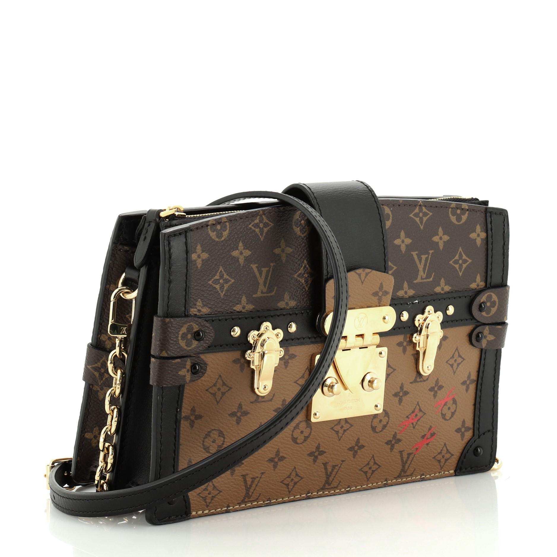 This Louis Vuitton Trunk Clutch Reverse Monogram Canvas is a classic bag with monogram pattern introduced in 1896 inspired by Japanese and oriental designs from the Victoria Era. Crafted in brown reverse monogram coated canvas, it features