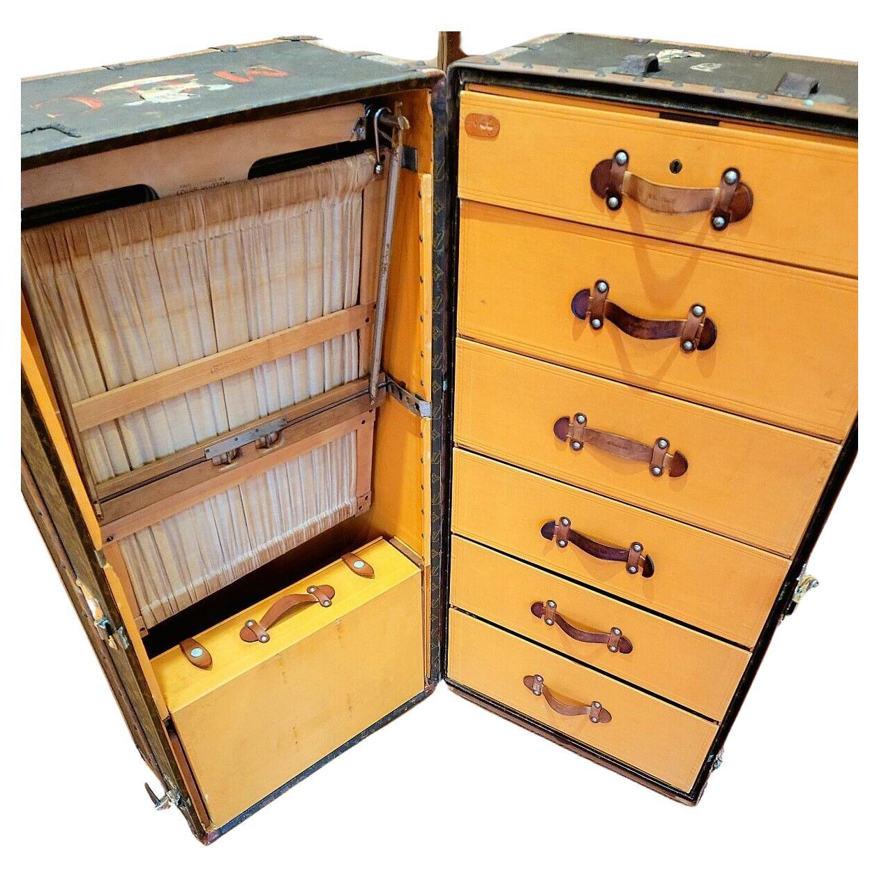 Louis Vuitton Wardrobe Trunk complete with all of the original interior. Circa 1960s. 90% complete.
Outside: Signs of wear and fading to the monogram see photos for a better idea of condition. One leather handle missing. If you need more photos