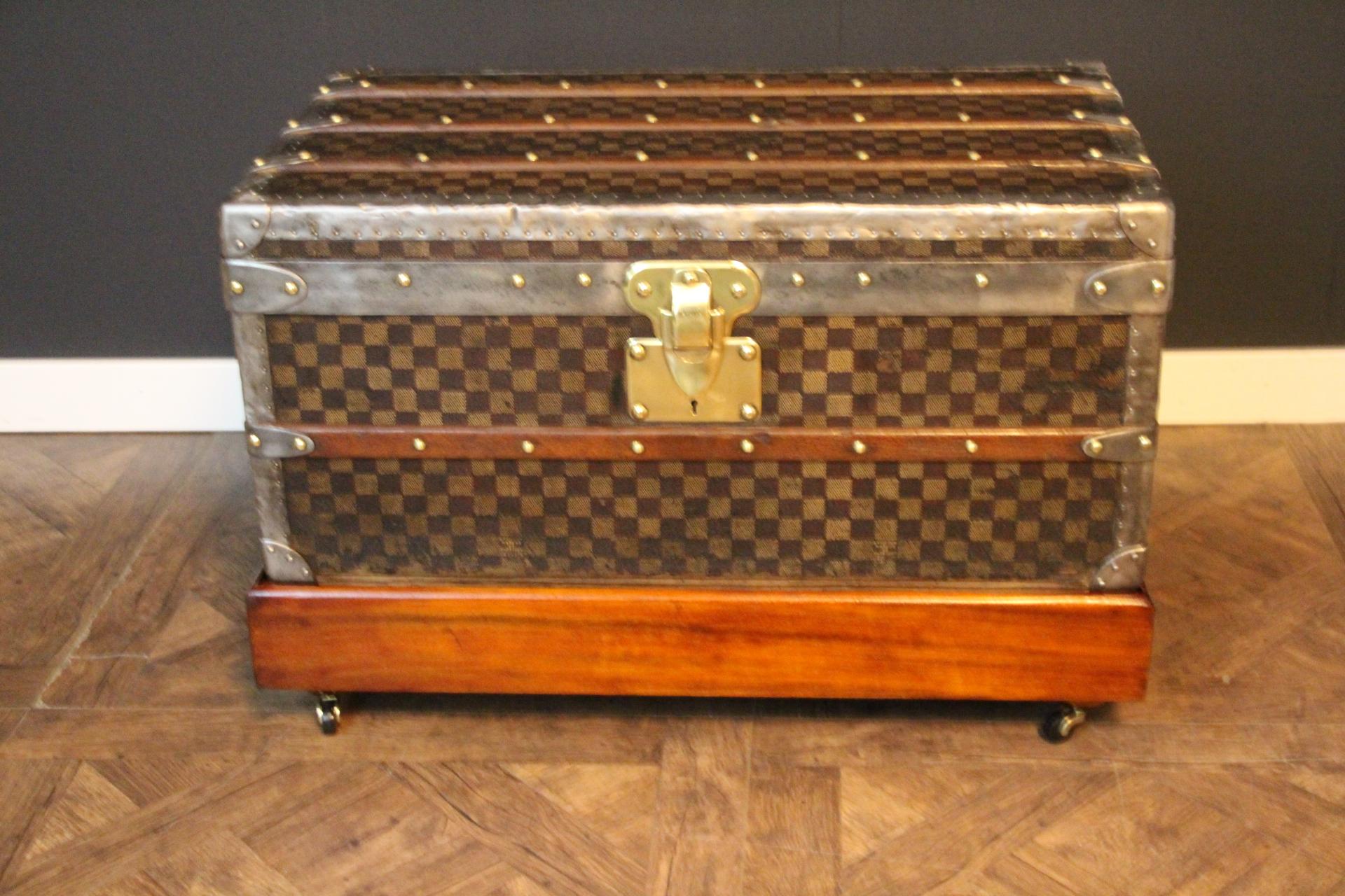 This beautiful Louis Vuitton trunk features the very rare and sought after checkered pattern canvas. This canvas that also called damiers canvas is typical from the end of the 19th century. Moreover, it features silver trim and  hardware: corners,