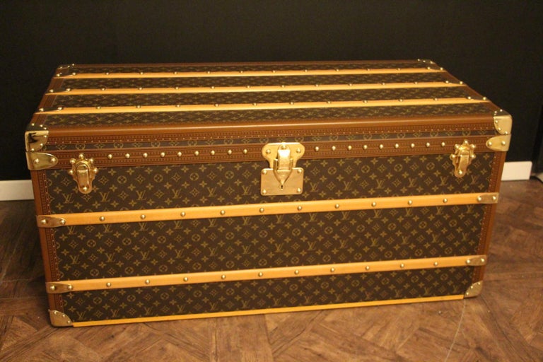 This superb Louis Vuitton steamer trunk features monogram canvas,honey color lozine trim, LV stamped solid brass locks and clasps , studs as well as leather side handles and brass corners. 
All its lozine trims are printed LV.
It has got a beautiful