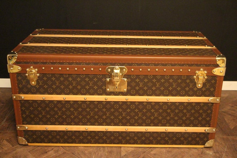 This superb Louis Vuitton steamer trunk features monogram canvas,honey color lozine trim, LV stamped solid brass locks and clasps , studs as well as leather side handles and brass corners. 
All its lozine trims are printed LV.
It has got a