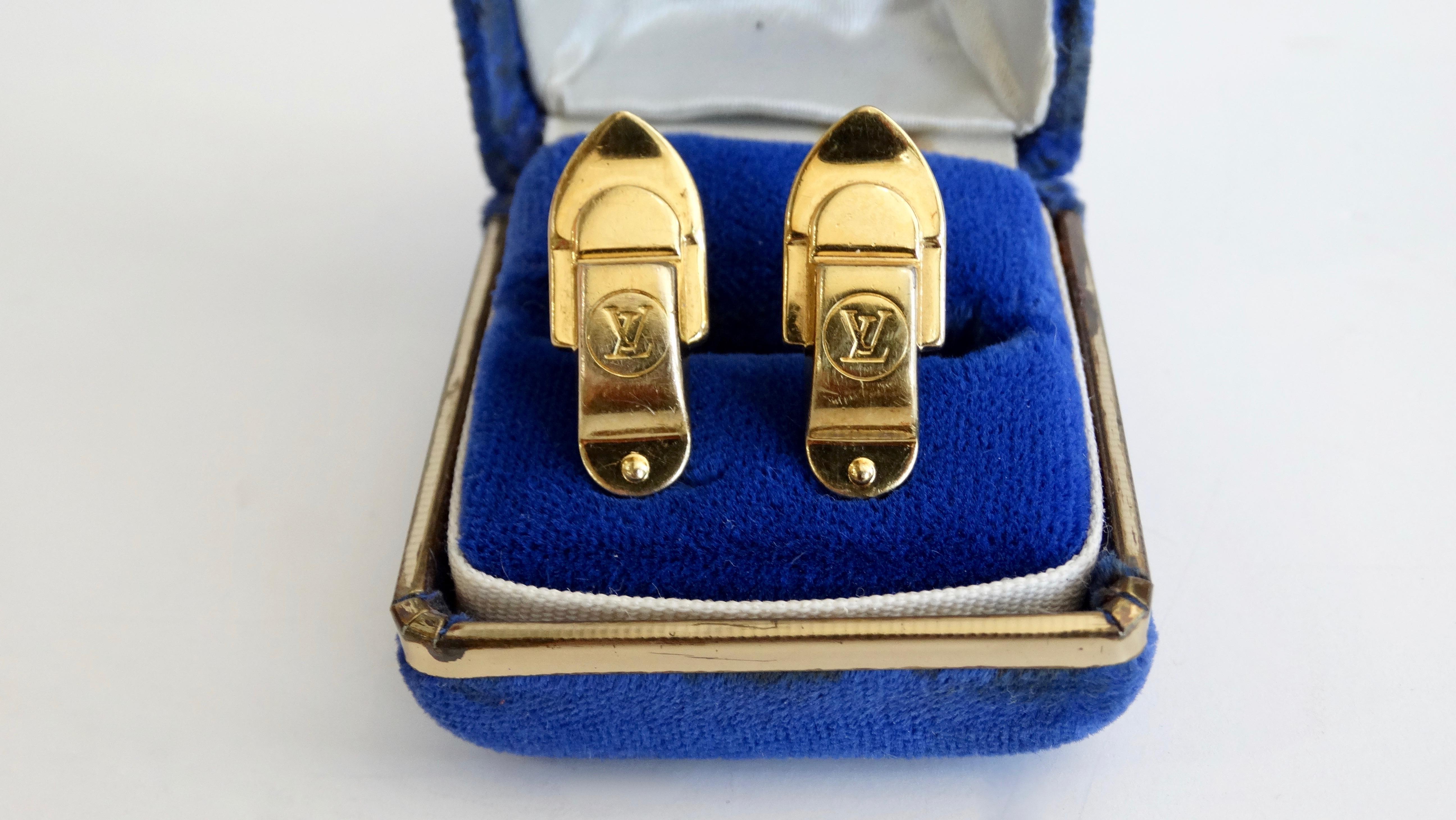 Less is more with these amazing Louie Vuitton cufflinks! Circa late 20th century, these gold plated cufflinks are modeled after the buckles found on Louie Vuitton's luggage and are stamped with the signature LV logo. Timeless and subtle, these