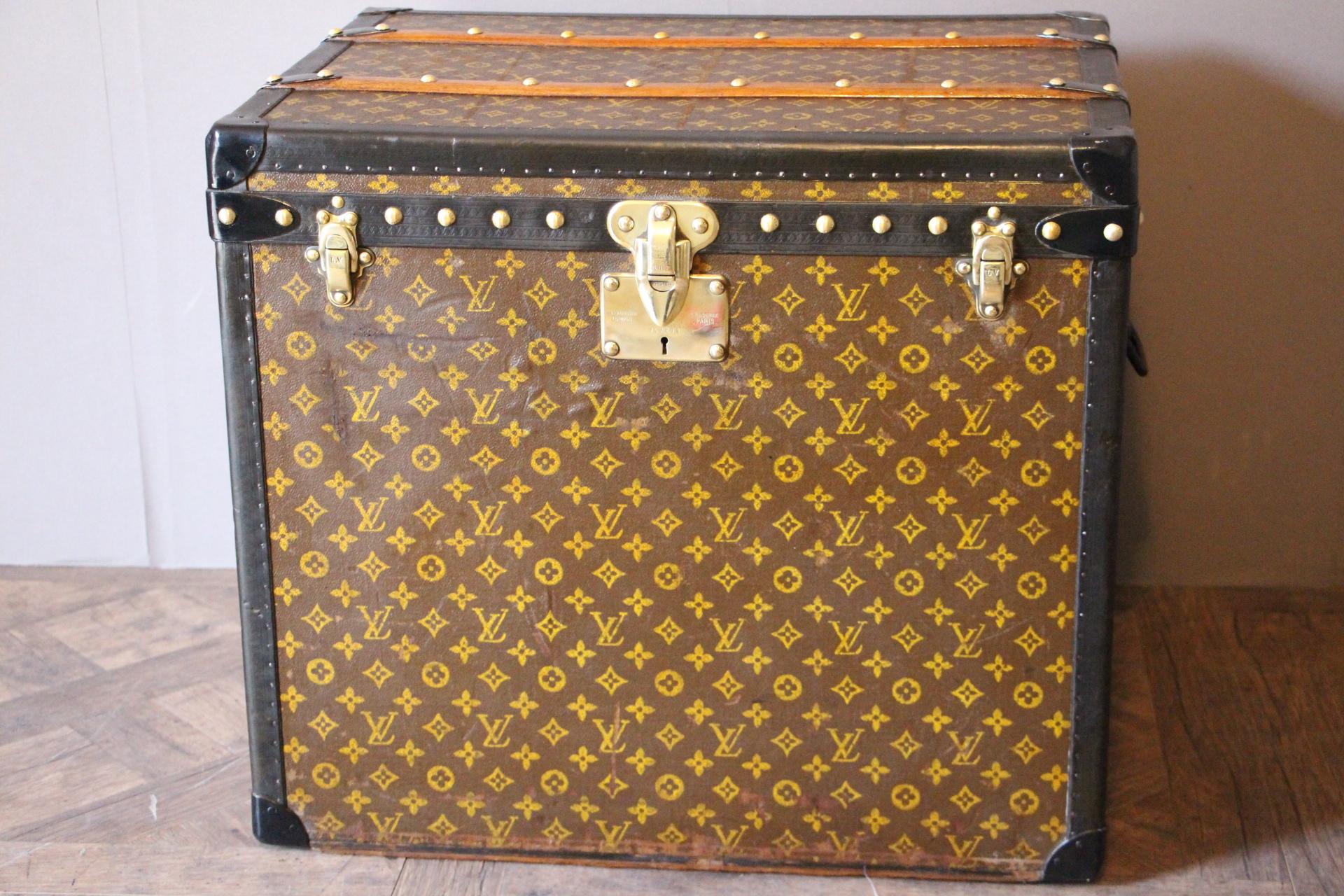 This beautiful trunk is very elegant and in very good condition. It has got the hand stencilled LV Monogram pattern canvas, all black lozine trim, brass fittings and black LV stamped steel handles. Solid brass LV marked studs and locks. No initials.