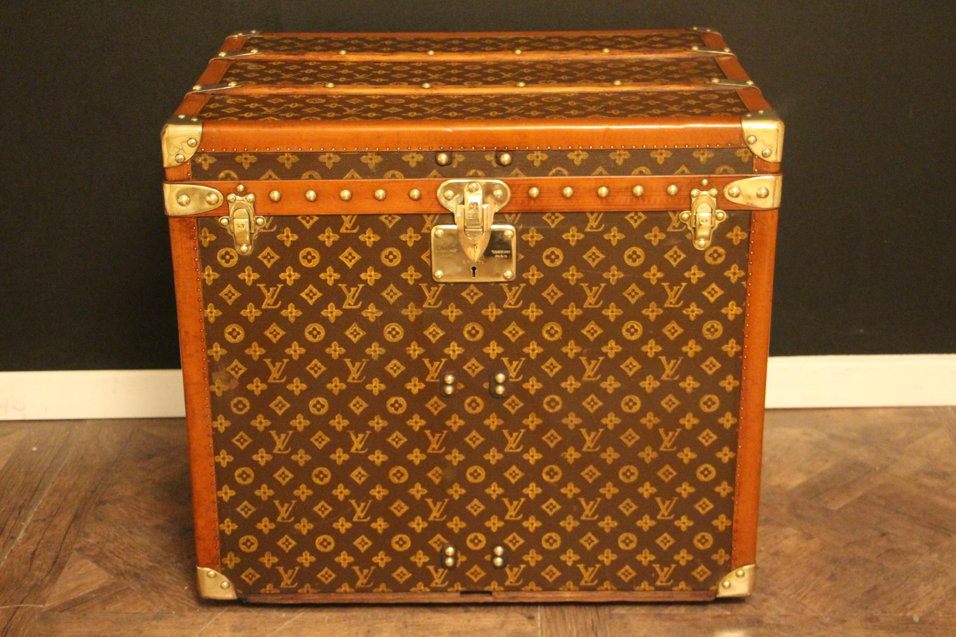 This beautiful and very rare Louis Vuitton trunk features stenciled monogram canvas, honey color lozine trim, large leather side handles, stamped Louis Vuitton brass studs, lock and clasps. Its patina is magnificent. Moreover it has a very sought