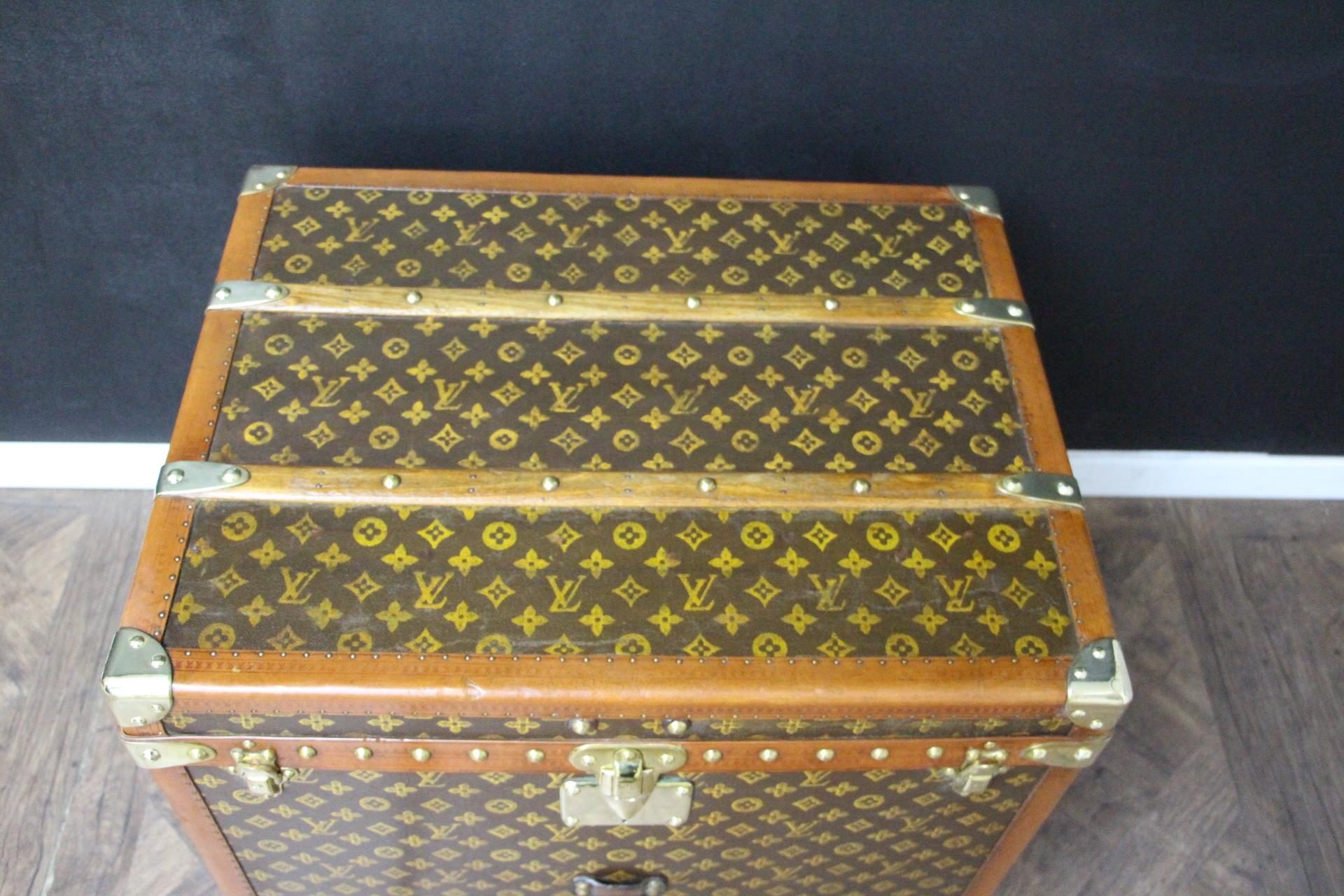 This beautiful and very rare Louis Vuitton trunk features stenciled monogram canvas, honey color lozine trim, large leather side handles, stamped Louis Vuitton brass studs, lock and clasps. Its patina is magnificent. Moreover it has a very sought