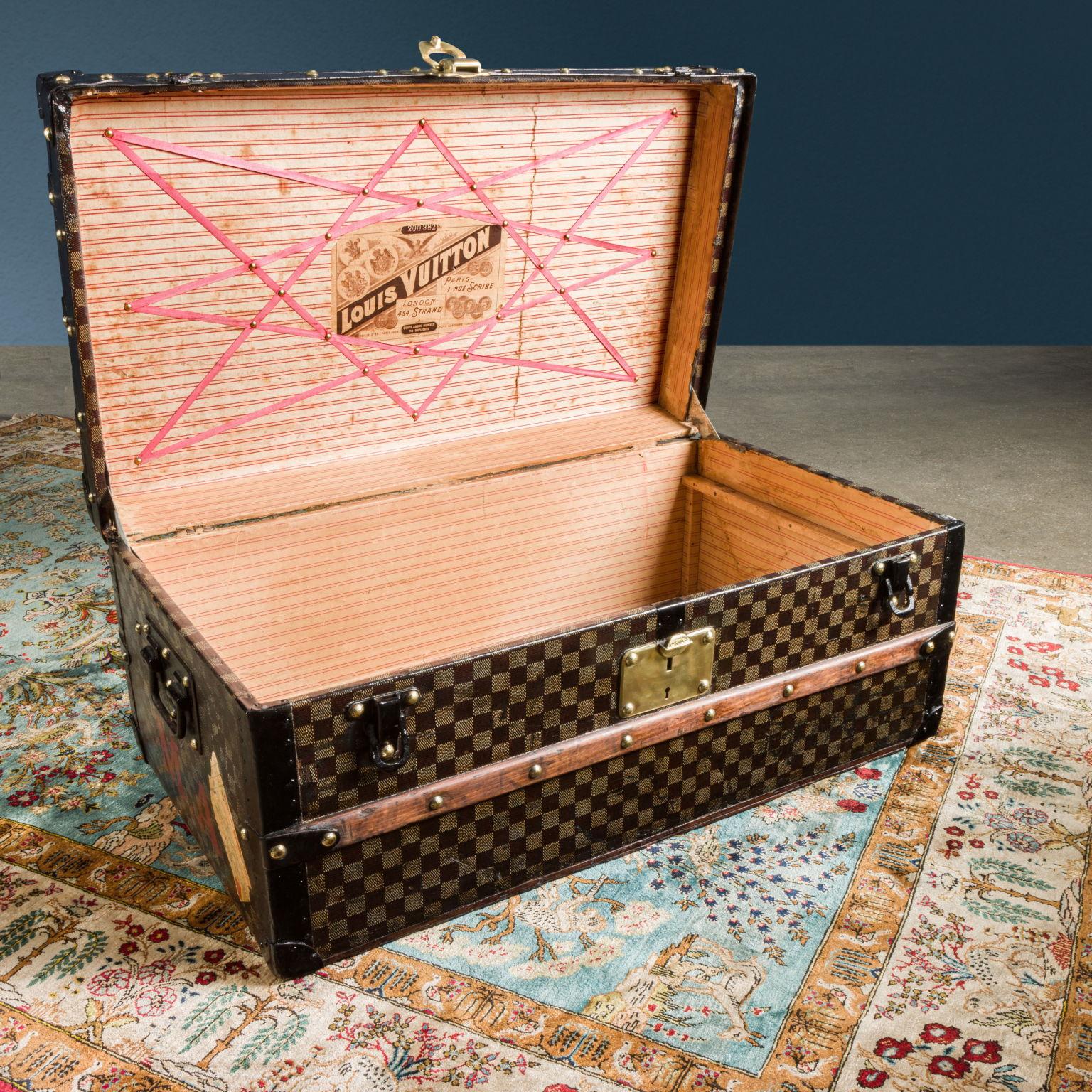 Louis Vuitton trunk from the late 1800s, restored to its original condition. It is a malle cabine, that is a trunk with a compact shape and small dimensions, created to be stored under the bed of the cabins of transatlantic liners. Upholstered in