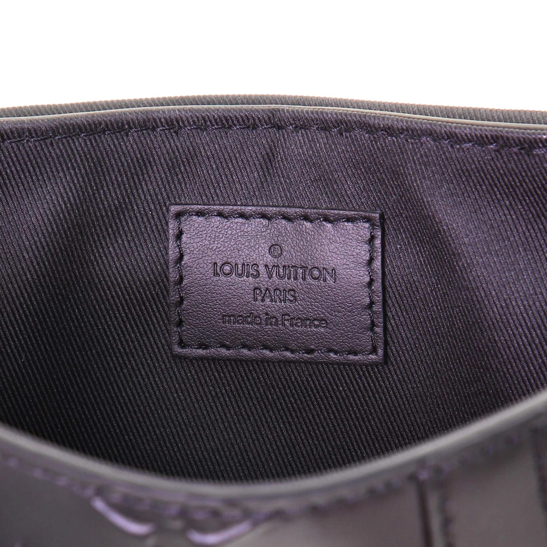 Louis Vuitton Trunk Slingbag Monogram Seal Leather In Good Condition In NY, NY