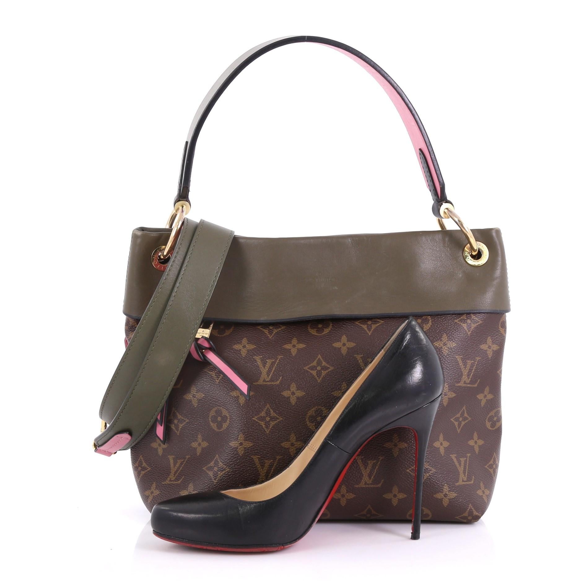 This Louis Vuitton Tuileries Besace Bag Monogram Canvas with Leather, crafted in brown monogram coated canvas with green leather, features a single loop leather handle and gold-tone hardware. Its hidden magnetic snap closure opens to a pink