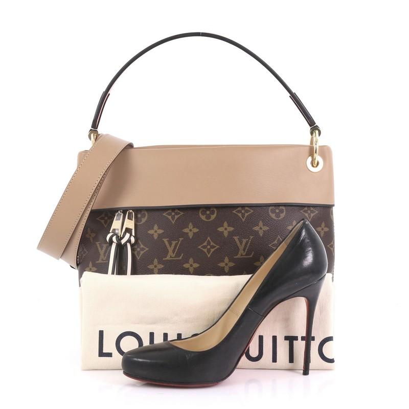 This Louis Vuitton Tuileries Besace Bag Monogram Canvas with Leather, crafted in brown monogram coated canvas with beige leather, features a single loop leather handle and gold-tone hardware. Its hidden magnetic snap closure opens to a beige