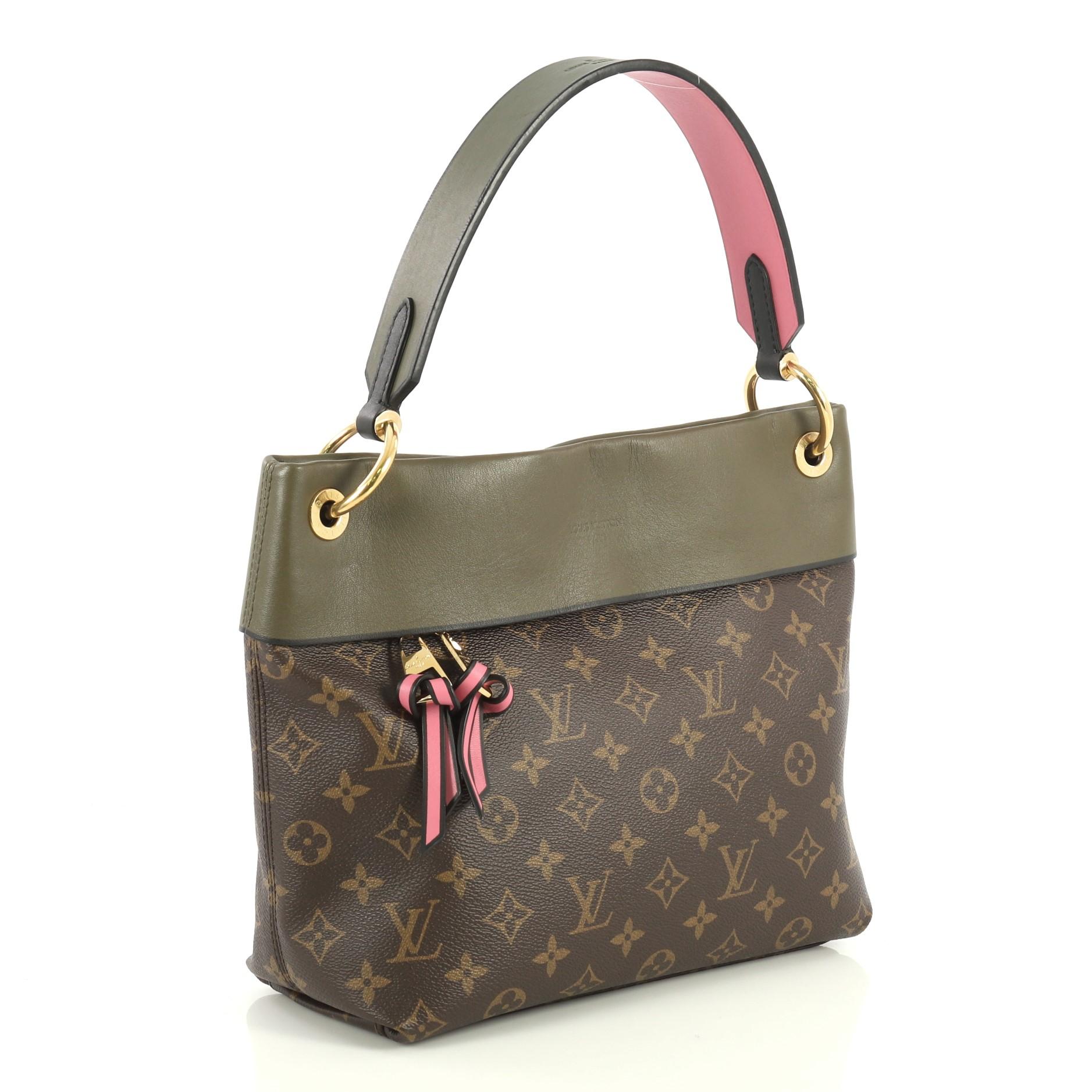 This Louis Vuitton Tuileries Besace Bag Monogram Canvas with Leather, crafted in brown monogram coated canvas with green leather, features a single loop leather handle and gold-tone hardware. Its hidden magnetic snap closure opens to a pink