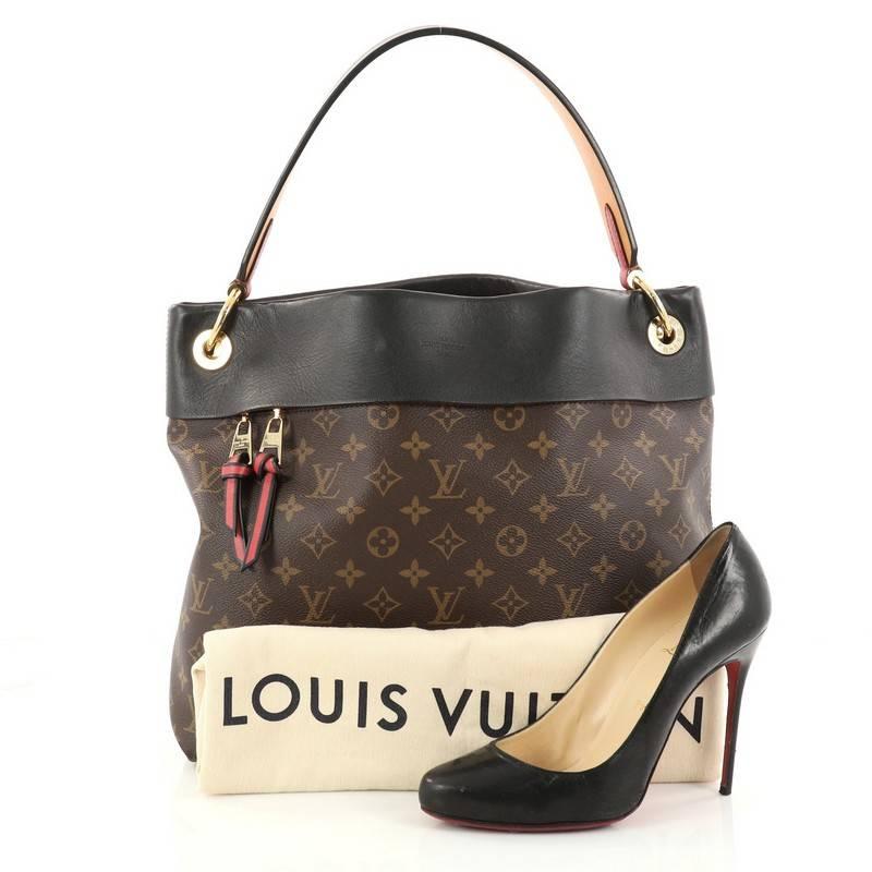 This authentic Louis Vuitton Tuileries Hobo Monogram Canvas with Leather from 2017 is inspired by the Tuileries Gardens in Paris. Crafted in brown monogram coated canvas and black leather, this ultra-functional bag features a flat leather handle,