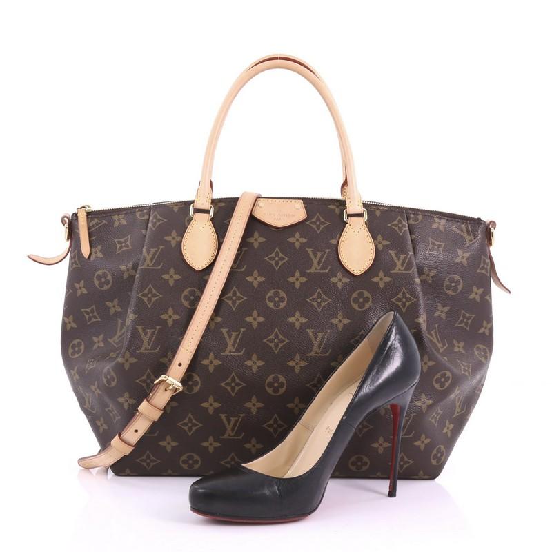This Louis Vuitton Turenne Handbag Monogram Canvas GM, crafted in brown monogram coated canvas, features dual rolled leather handles, front pleats, and gold-tone hardware. Its zip closure opens to a brown fabric interior with slip pockets.