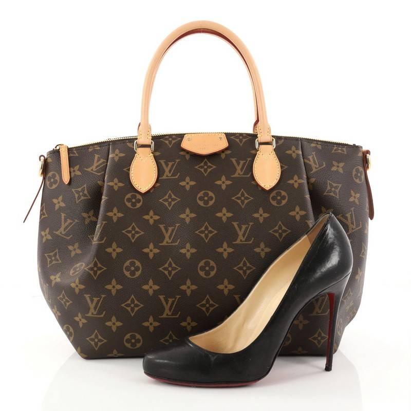 This authentic Louis Vuitton Turenne Handbag Monogram Canvas MM is an elegant must-have made for the sophisticated on-the-go woman. Crafted from brown monogram coated canvas with natural cowhide vachetta leather trims, this city satchel features